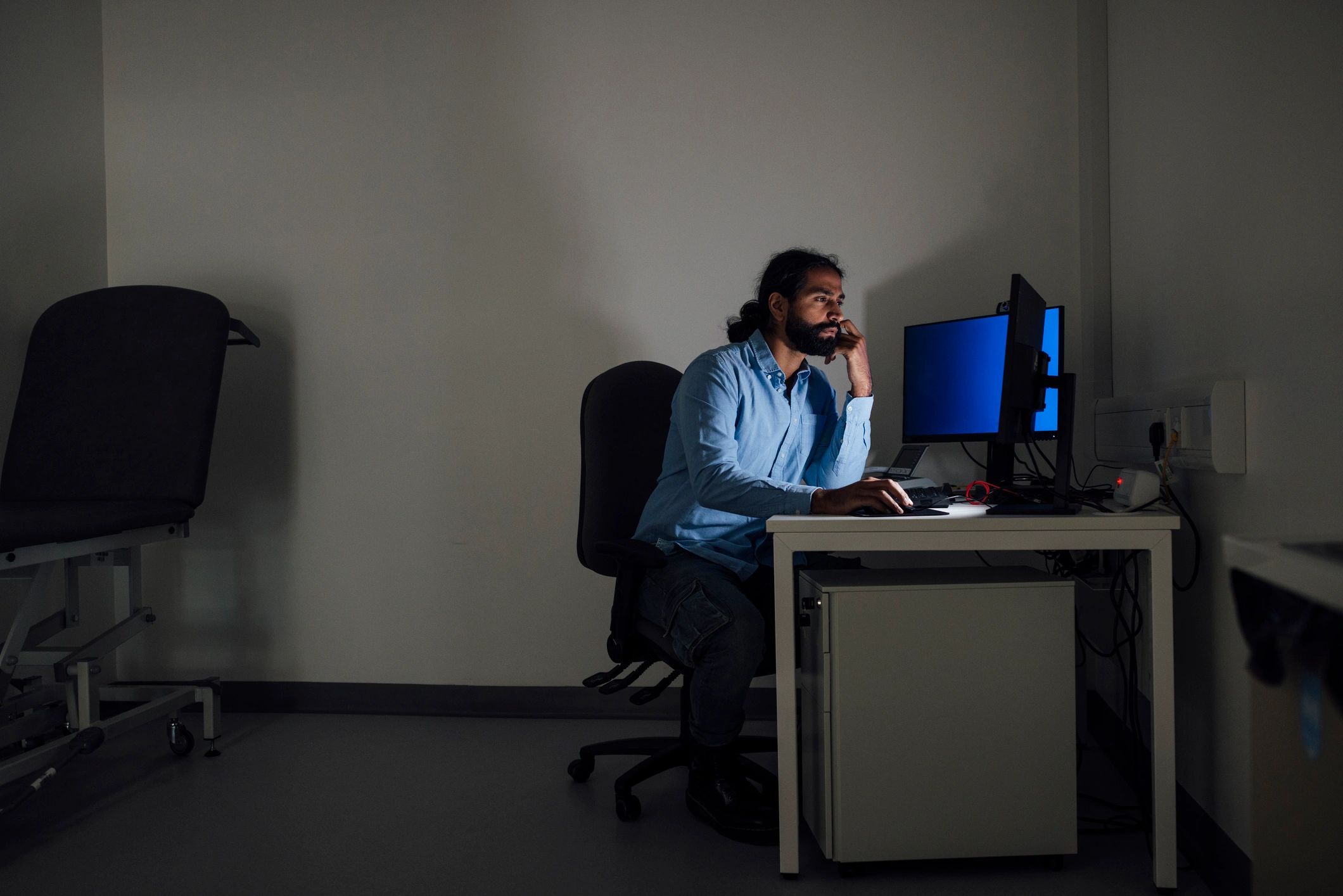 Technician working at a modern home office setup